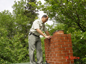 home inspector checks chimney