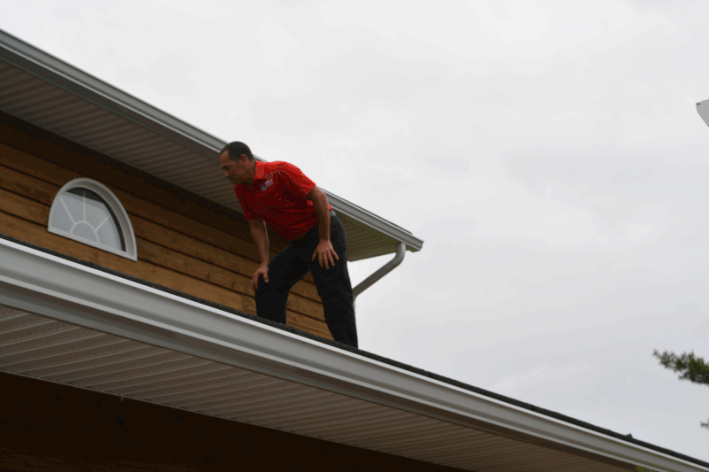 home inspector checks roof